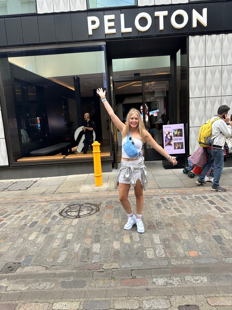 Jules in front of the Peloton Studios in London