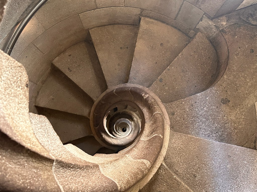 A spiral staircase looking down in a tower in the La Sagrada Familia church in Barcelona, Spain.
