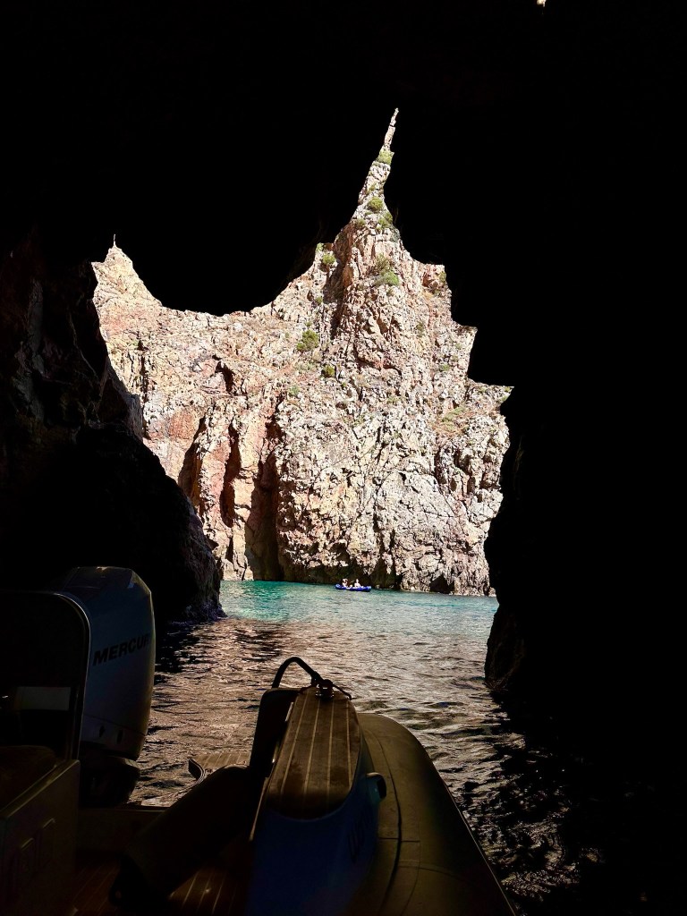 A famous cove in the water that when you turn the boat back around to the opening you come in on, the opening is in the shape of the island of Sardinia!