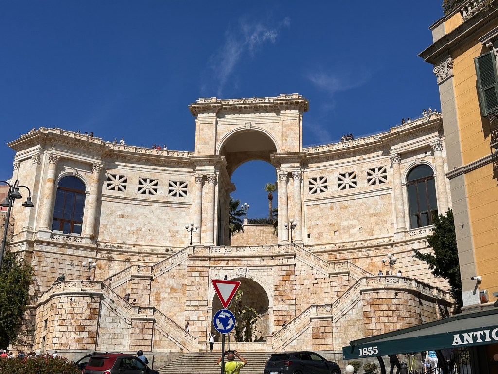 In the heart of Cagliari lies Saint Remy Bastión, one of the most important monuments in the city. Once used as a banquet hall, an infirmary and shelter for those displaced by bombings during the war, it stands grand and tall in otherwise a tightly built city.