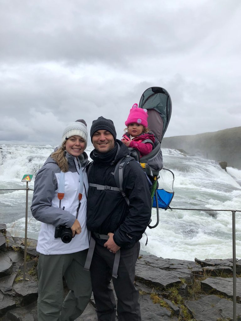 Family photo in front of gullfoss waterfall in Iceland