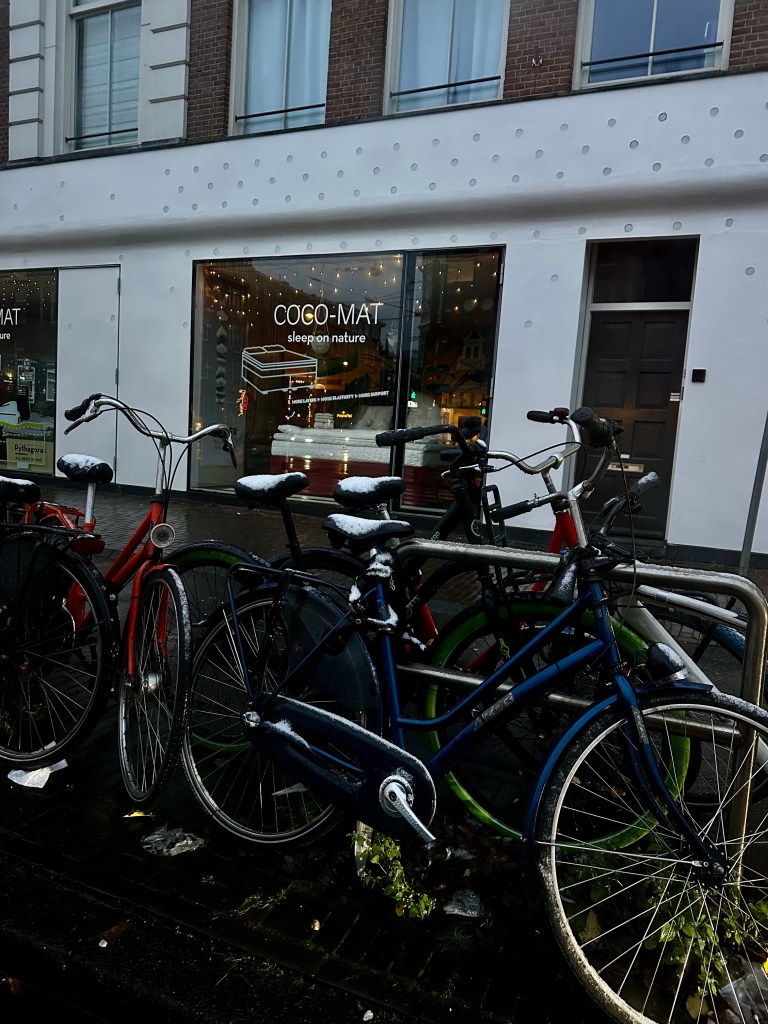 Bikes with snow in the streets of Amsterdam
