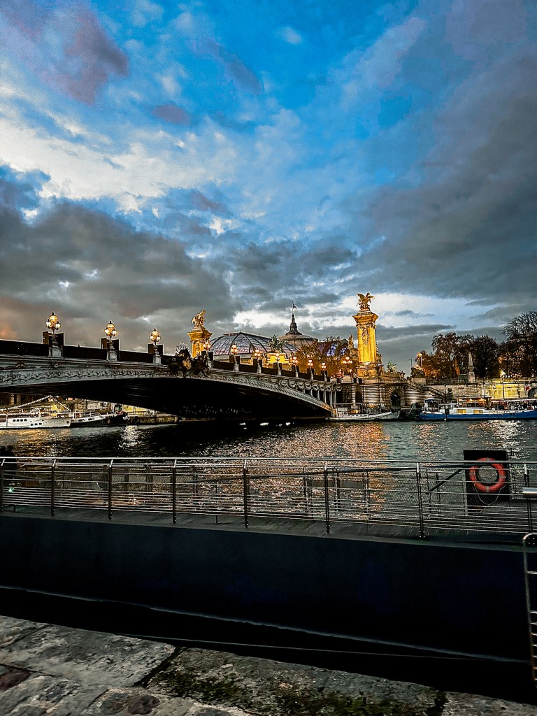 The Pont Alexandre III Bridge in Paris over the Seine at dusk