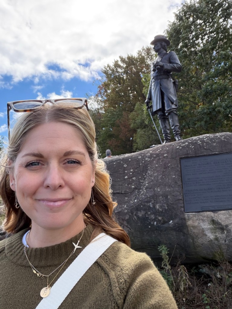 Me standing in front of a statue on Little Round Top on the Gettysburg tour 